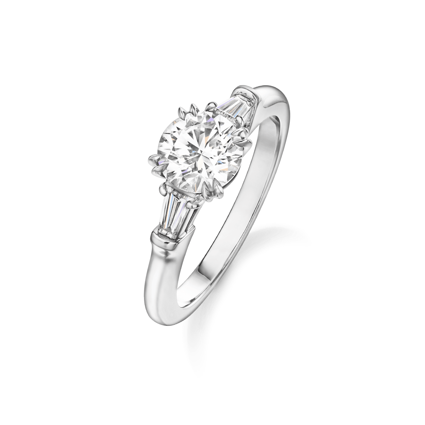 Angled view of the Classic Winston Round Brilliant Engagement Ring with Tapered Baguette Side Stones