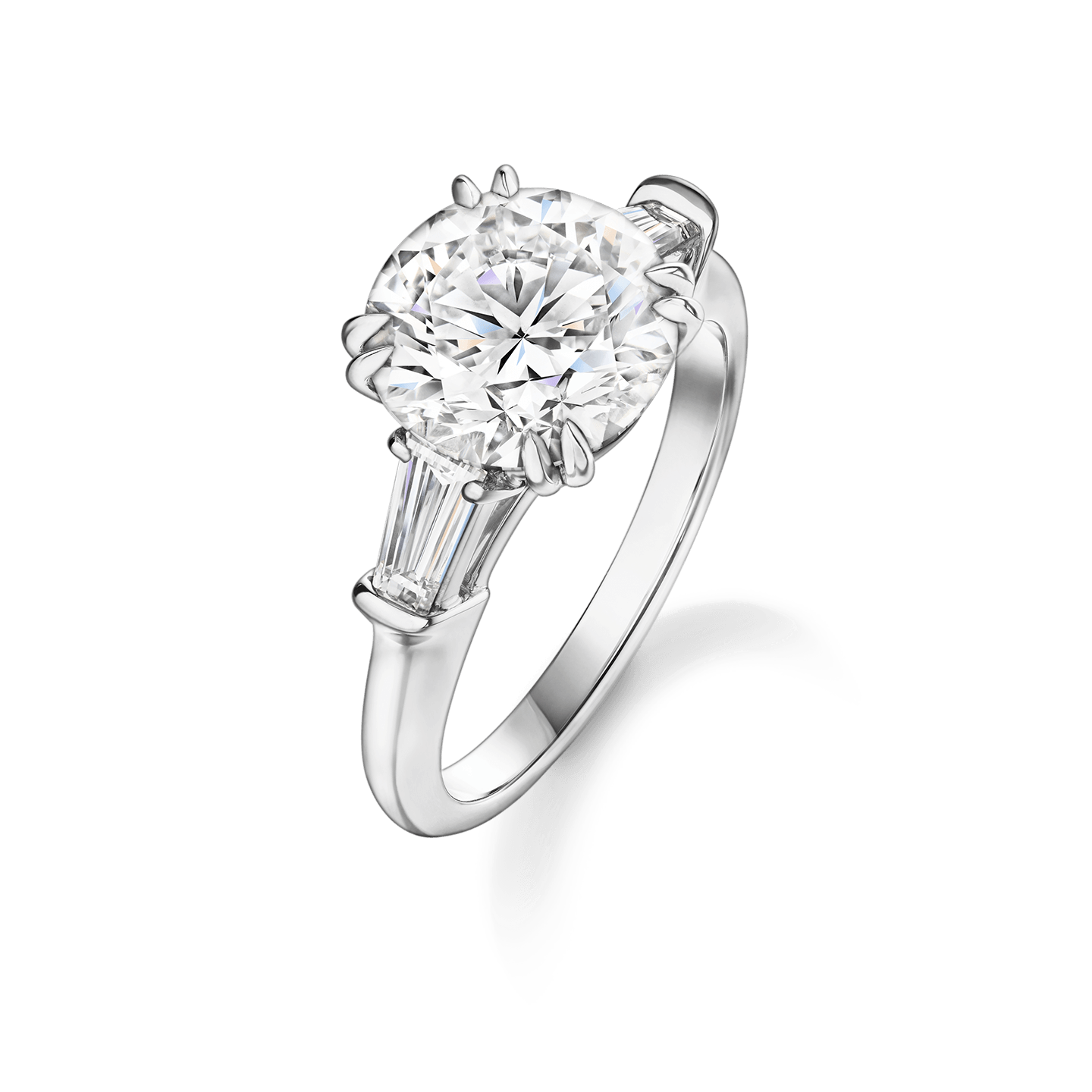 Angled view of the Classic Winston Round Brilliant Engagement Ring with Tapered Baguette Side Stones